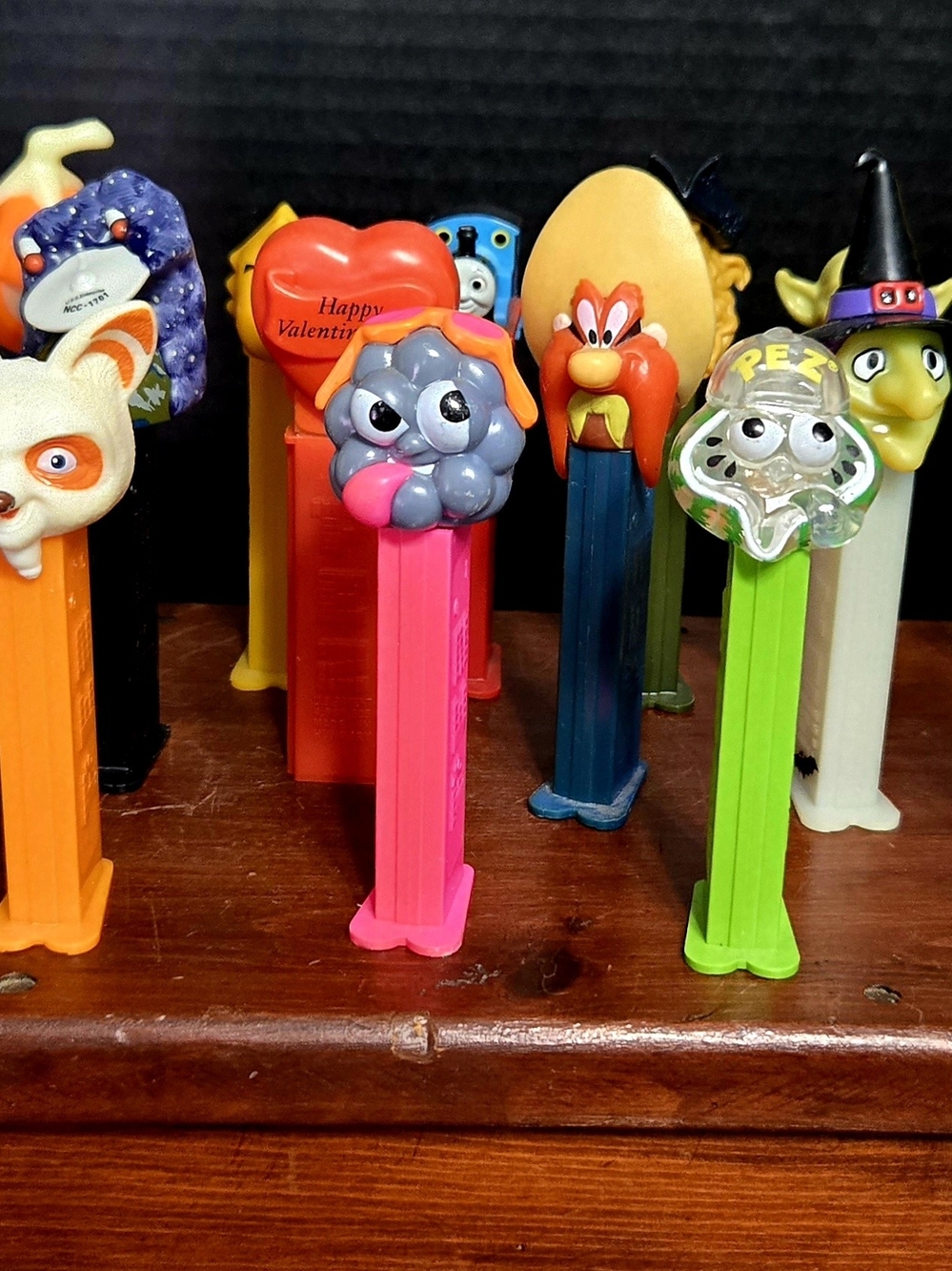 This vibrant collection features an eclectic mix of vintage and modern PEZ dispe